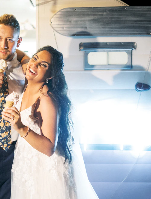 bride and groom eating ice cream in front of a truck RG|NY