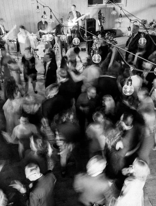 blurry wedding photo of people dancing RG|NY